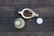 Bottle of sesame milk on black wood background