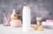 Bottle of shampoo, body care, soap and towel on a wooden background