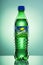 Bottle of Sprite drink on gradient background.