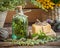 Bottle of tarragon tincture, healthy herbs and bars of soap