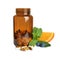 Bottle with vitamin pills, orange, blueberries and mint on background