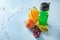Bottle of water, fruits and measuring tape on light background. Healthy food concept