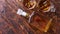 Bottle of whiskey with two glasses placed on rustic wooden table