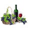 A bottle of wine and a basket of grapes