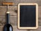 Bottle of wine and blank blackboard