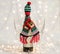 Bottle of wine in a christmas woolen scarf and hat
