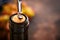 Bottle wine with corkscrew. Opening a wine bottle with a corkscrew in a restaurant. Wine composition on dark rustic background