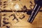 Bottle of wine and an empty wineglass on an aged wood box, top view, selective focus