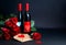 Bottle of wine, envelope, hearts and roses on dark background. Valentine\\\'s Day celebration