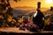 Bottle of wine, glass and bunch grape on the table with view of vineyard and sunset sky. Generative AI