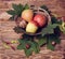 Bottle of wine, glass, leaves, wooden