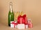 Bottle and wine glasses with champagne, gift boxes