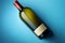 Bottle of wine on a pastel blue background. topview.