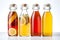 Bottled kombucha tea. Set of glass bottles with filtered kombucha drinks made of yeast, sugar and tea with addition of fruits,