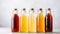 Bottled kombucha tea. Set of glass bottles with filtered kombucha drinks made of yeast, sugar and tea with addition of fruits and