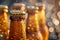 Bottles with beer on blurred background on sunset. Craft beer. Picnic, party, beer festival. Brewing