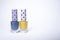 Bottles with blue and yellow nail polish on white background. nail lacquer. Nail manicure concept. Isolated, copy space