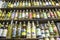 bottles of cachaca on a shelf, inside a shop in the historic city of Paraty