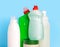 Bottles of cleaning products for the home on a blue background. Cleaning of the apartment