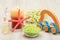 Bottles with cream for face skin and aromatic oil, bowl with sea salt, burning candle, starfish, hand massager and bouquet of