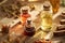 Bottles of essential oils with frankincense and myrrh resin, cinnamon and herbs