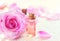 Bottles of essential rose oil for aromatherapy. Rose spa