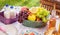 Bottles of fresh milk, juice and fruit at a picnic