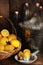 Bottles of fresh squeezed lemonade in a metal bucket filled with ice with warm side light