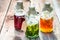 Bottles with honey, linden, mint and alcohol as natural medicine