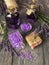 Bottles with lavender infusion closed with cork, soap and sea salt, close-up