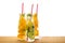 bottles of lemonade with lemon, orange, lime, twig mint, cucumber, ginger and straws on wooden background isolated, concept of re