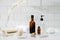 Bottles with massage essentials oils, towels and zen stones. Spa composition