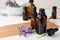 Bottles with natural lavender essential oil on wooden board