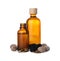 Bottles of nutmeg oil, nuts and pipette on white background