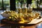 Bottles of olive oil and green olives on a wooden table