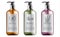 Bottles of organic shampoo with herbal care. Various plants and colors. Mint, orange and lavender