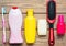 Bottles of shampoo, shower gel, soap, perfume, toothbrush, comb. Products for the care of beauty and hygiene.