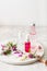 Bottles skincare lotion serum medical flowers herbs. natural cosmetic. clover milfoil tansy rosebay