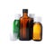 Bottles of syrups with measuring cups on white background. Cough and cold medicine