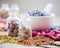 Bottles of tablets, healing herbs and mortar with lavender