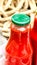 Bottles of tomato sauce, preserved canned pickled food concept isolated in a rustic composition