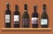 Bottles of wine are on the shelf. Wooden background.