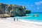 Bottom Bay, Barbados - Paradise beach on the Caribbean island of Barbados. Tropical coast with palms hanging over turquoise sea.