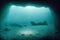 At bottom of ocean lie wreckage of wooden ship after shipwreck beneath.