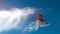 BOTTOM UP: Athletic man jumps in the air and does a cool trick on his snowboard.