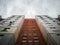 Bottom-up view of an old residential multi-storey prefabricated concrete house in the style of modernism in Eastern Europe