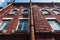 Bottom view of a beautiful red brick building. The architecture of past centuries