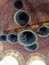 Bottom view of bells with installed microphones on bell tower of Orthodox church. Brickwork of domed vault from inside. Close-up.