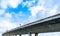 Bottom view of elevated concrete highway. Overpass concrete road. Road flyover structure. Modern motorway. Transportation