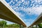 Bottom view of elevated concrete highway. Overpass concrete road. Strong structure of cement bridge. Concrete bridge engineering